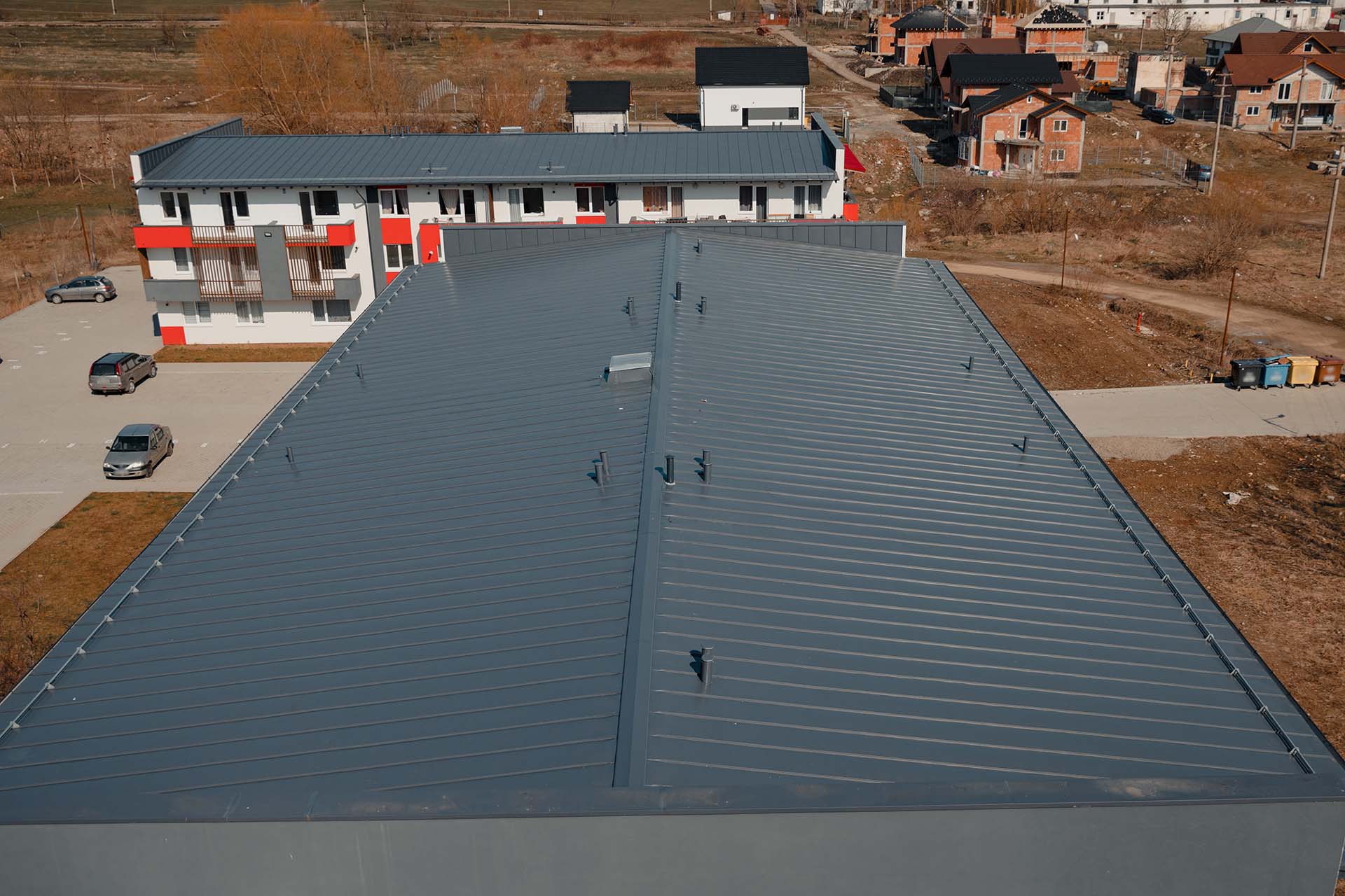 New tin roof on the apartment building. Watterproof roofing system